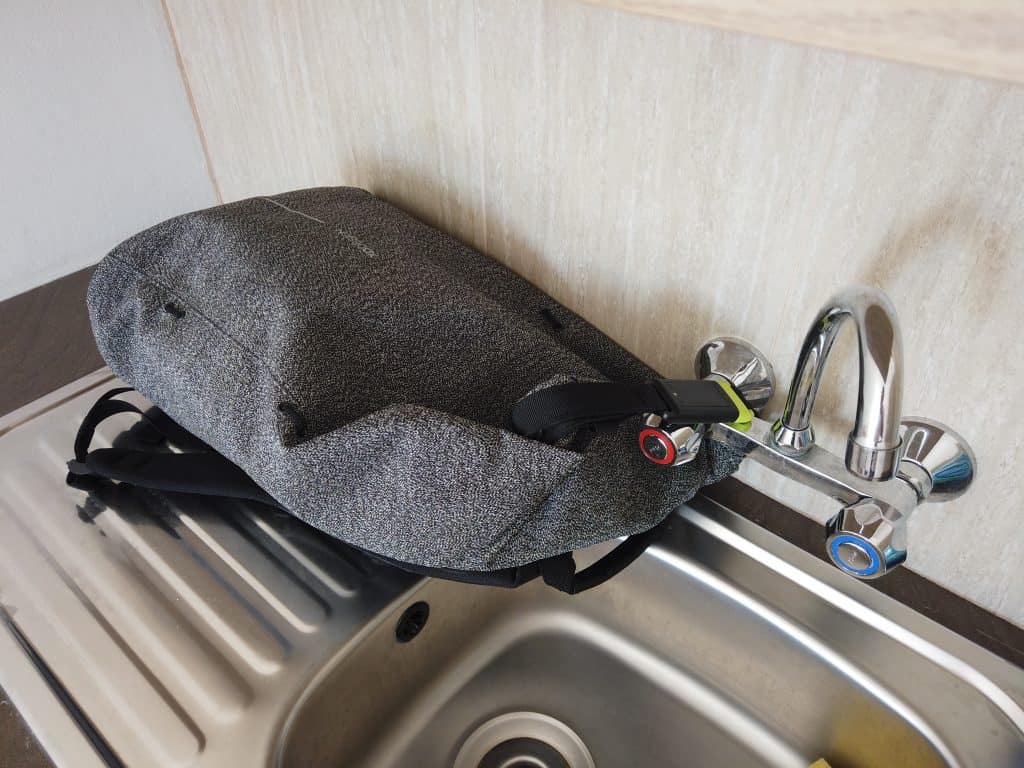 XD Designs Bobby Urban Anti-Theft backpack padlocked around a sink so nobody can steal it