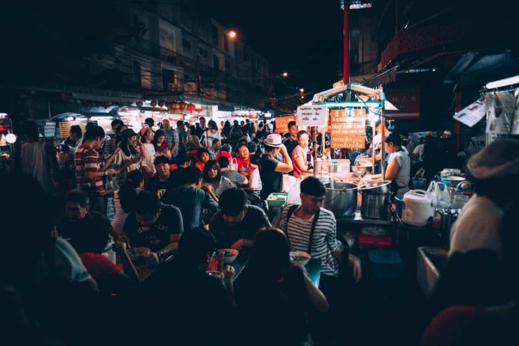 street food surrounded by people in Thailand at night